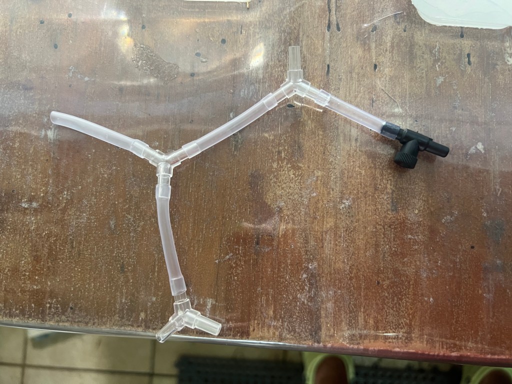 Three tube splitters connected by tubing