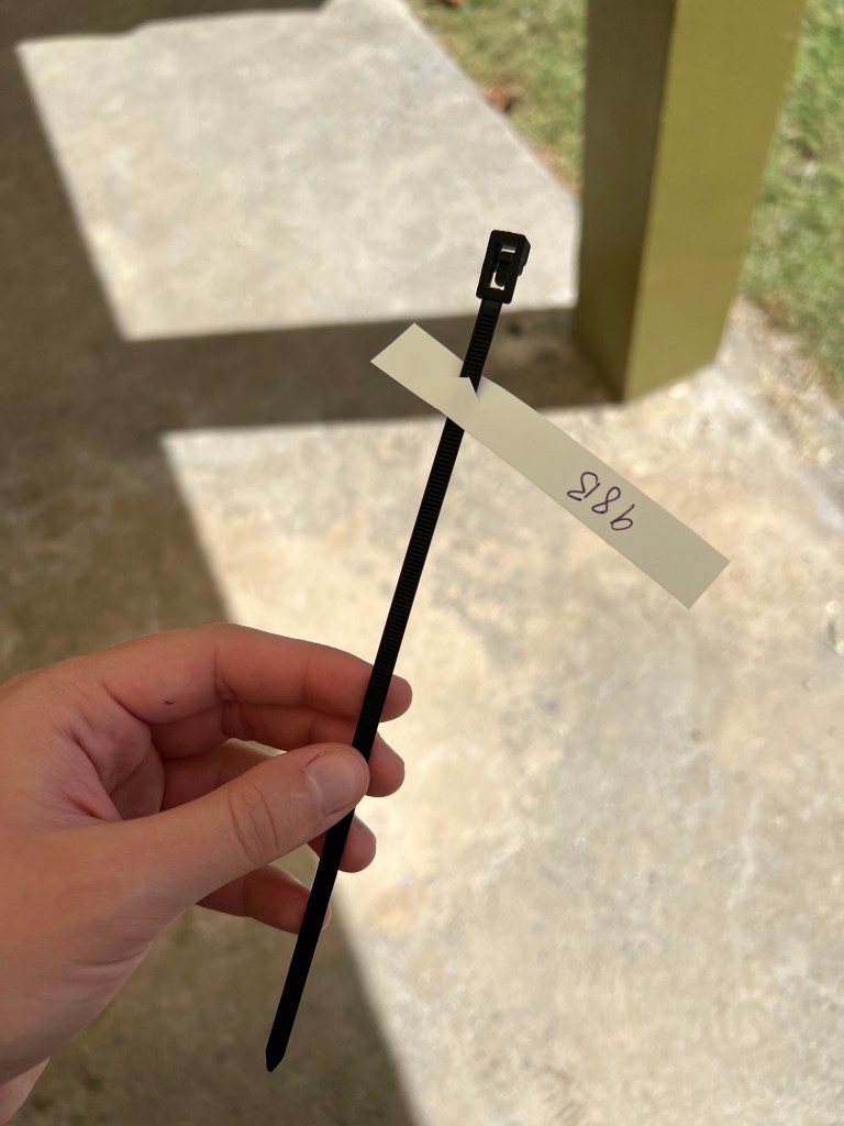 A zip tie with a tag on it